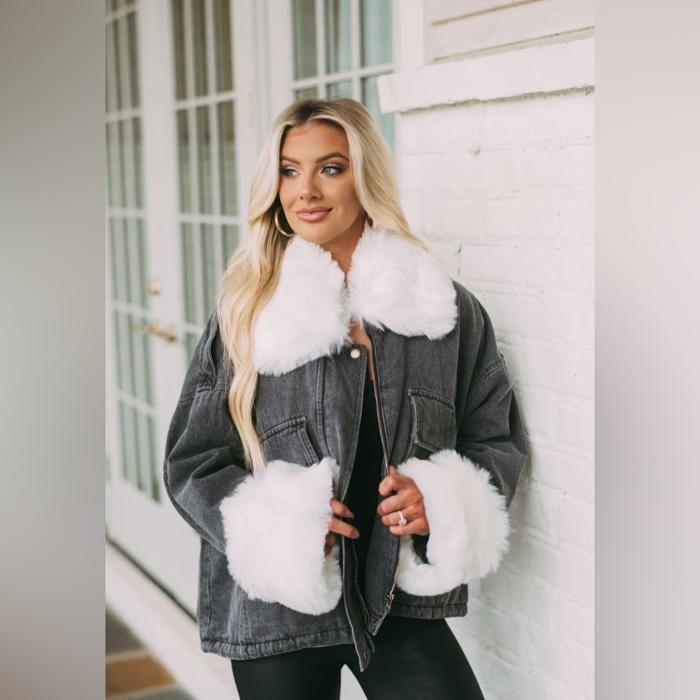 Black jacket with fur sleeve cuffs and neck